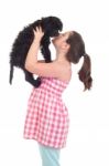 Girl Kissing Dog Stock Photo