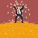 Businessman Celebrates On Money Staircase Stock Photo