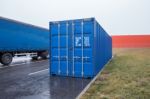 Blue Transportation Container And Truck On Parking Stock Photo