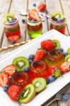 Red And Green Jelly Served With Fruit Stock Photo