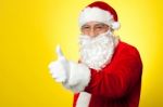 Santa Showing Thumbs Up Gesture To Camera Stock Photo