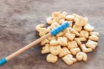 Alphabet Biscuit In Wooden Table Stock Photo