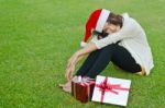 Santa Claus Hat With Red Christmas Gift Box Stock Photo