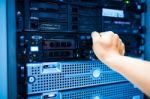 People Fix Server Network In Data Room Stock Photo