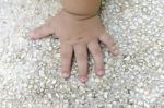 Children Hand On Gravel Stock Photo