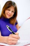 Woman Verifying Document Stock Photo