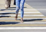 Young Woman Crossing A Street In The City Stock Photo