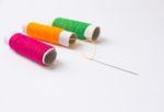 Sewing Threads And Needle Background Stock Photo