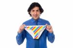 Young Man Holding Multicolored Underwear Stock Photo