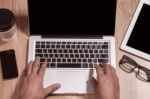 Hands Typing On A Notebook Stock Photo