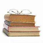 Glasses on Old Books Stock Photo