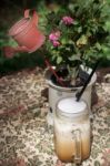 Iced Milk Coffee On Outdoor Table Stock Photo