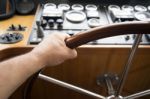 Commander Hands On The Boat Wheel Stock Photo