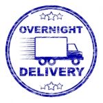 Overnight Delivery Stamp Shows Next Day And Courier Stock Photo