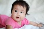 Sweet Newborn Baby Lies On Bed Stock Photo