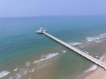 Aerial View Of Pier Bridge Into Blue Sea Stock Photo