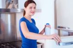 Woman With Milk Bottle Stock Photo