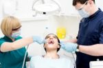 Dentist Cleaning A Woman Teeth Stock Photo