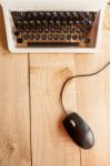 Old Typewriter Connected To A Computer Mouse Stock Photo