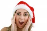 Surprised Woman In Santa Hat Stock Photo