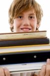 Book Pile With Student Holding Books Stock Photo