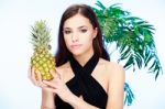 Woman Holding Pineapple Stock Photo