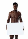 Naked Black Man with blank board Stock Photo