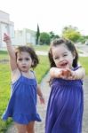 Small Little Girls Standing Stock Photo