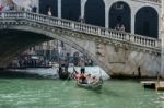 Gondoliers Ferrying People In Venice Stock Photo