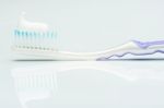 Close Up Of Tooth Paste On Brush Stock Photo