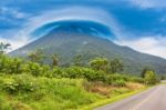 View At The Volcano Arenal Peak Covered In Clouds, Costa Rica Stock Photo