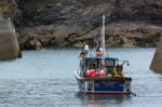 Fishing Boat In Port Isaac Cornwall Stock Photo