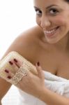 Front View Of Woman Scrubbing Her Body Stock Photo