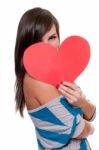 Pretty Girl Behind Valentine's Day Heart Stock Photo