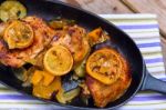 Delicious Baked Chicken Thighs With Lemon Slices, Onion And Zucchini Stock Photo