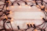 Christmas Lights,garland Lights On Wooden Background Stock Photo