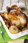 Roasted Chicken With Apples And Potatoes Stock Photo