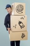 Delivery Man Carrying A Cardboard Boxes Stock Photo