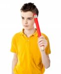 Thoughtful Boy Holding Pencil Stock Photo