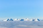 Snowy Mountains And Clouds Stock Photo