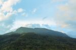 Scenic Of Clouds Over Mountain Stock Photo