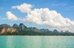 High Mountain Range Above The Green Lake Stock Photo