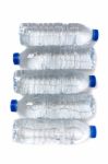 Row Of Plastic Water Bottles Isolated On A White Background Stock Photo