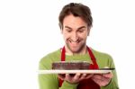 Chef Holding Yummy Chocolate Cake Stock Photo