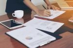 Woman Standing And Writing Document Hand Close Up At Desk Stock Photo