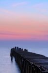 Fishing Pier At Sunrise Stock Photo