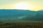 Sunrise Behind The Mountain Stock Photo