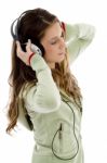 Attractive Female Enjoying Music Stock Photo