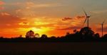 Sunset & Wind Turbines Stock Photo