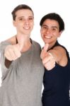 Sisters Showing Thumbs Up Stock Photo